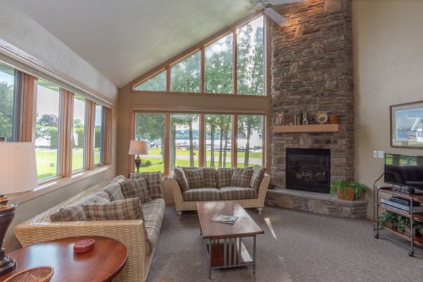 Mariners Retreat has a living room with fireplace and water views overlooking a private beach and marinas bluff views